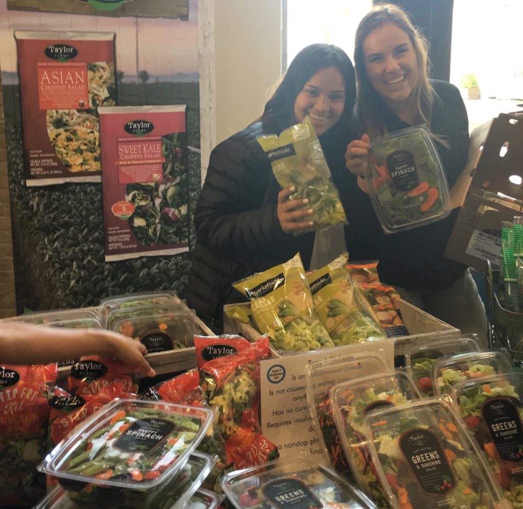 Taylor Farms Interns, Rachelle Proa and Quincey Gourley, supporting Market sales